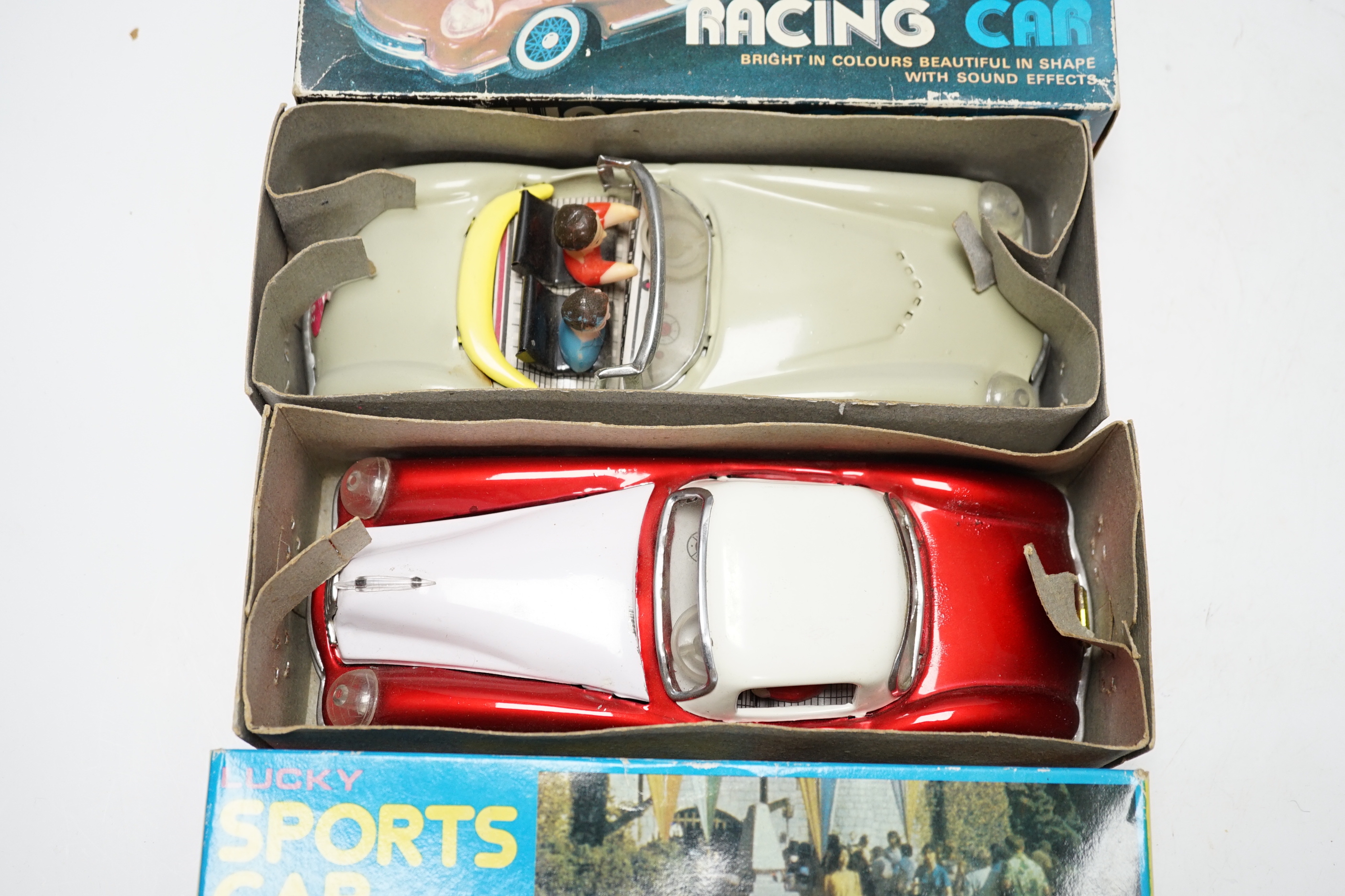 Thirteen modern tinplate clockwork toys including; a fire truck, sports cars, racing cars, a clockwork sparrow, a clockwork frog, etc. (14)